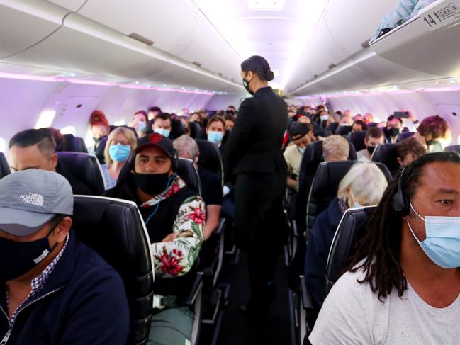 SYDNEY, AUSTRALIA - APRIL 19: Passengers are seen boarding Air New Zealand flight number 246 destined for Wellington on April 19, 2021 in Sydney, Australia. The trans-Tasman travel bubble between New Zealand and Australia begins on Monday, with people able to travel between the two countries without needing to quarantine. (Photo by Lisa Maree Williams/Getty Images) *** BESTPIX ***