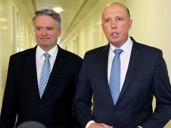 Mathias Cormann and Peter Dutton leaving the party room after losing the vote. Picture: Ray Strange