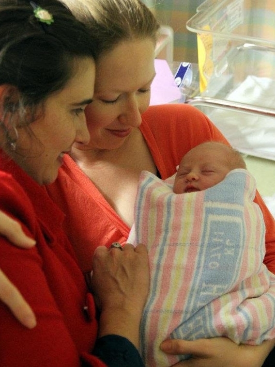 Health Editor Natasha Robinson with her sister Sara Fishwick and Josie on the day she was born.