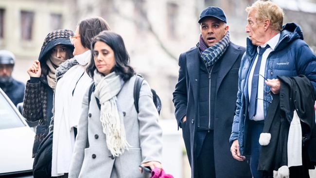 Indian-Swiss billionaire family members Namrata Hinduja, left, and Ajay Hinduja, second from right, arrive at the Geneva courthouse with their lawyers Yael Hayat, centre, and Robert Assael, right, at the opening day of their trial for human trafficking on January 15, 2024. Picture: Gabriel Monnet/AFP