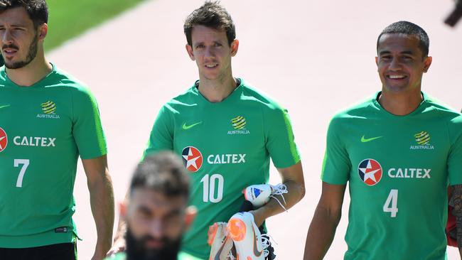 Australia's Mathew Leckie, Robbie Kruse and Tim Cahill arrive for a training session at their training base, Stadium Trudovye Rezervy, during the FIFA 2018 World Cup in Kazan, Russia, Sunday, June 24, 2018. Australia take on Peru in their final group match this Tuesday in Sochi. (AAP Image/Dean Lewins) NO ARCHIVING