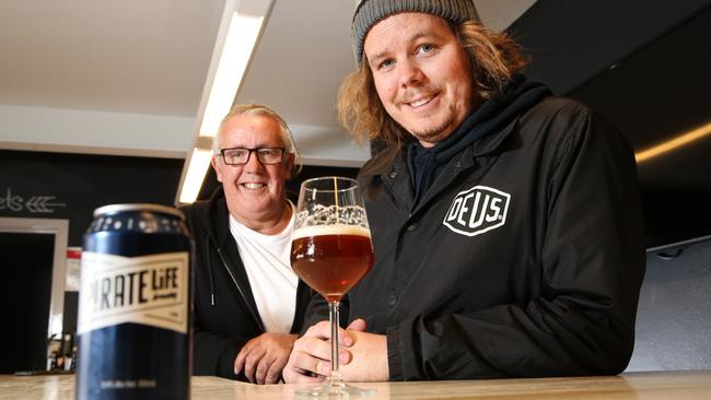 Michael Cameron (left) and son Jack with a can of their Pirate Life beer.