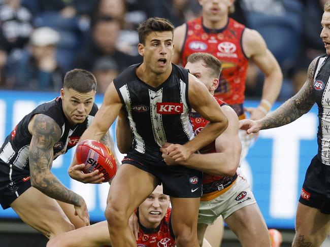 Adelaide works to keep Daicos in check. Picture: Michael Klein