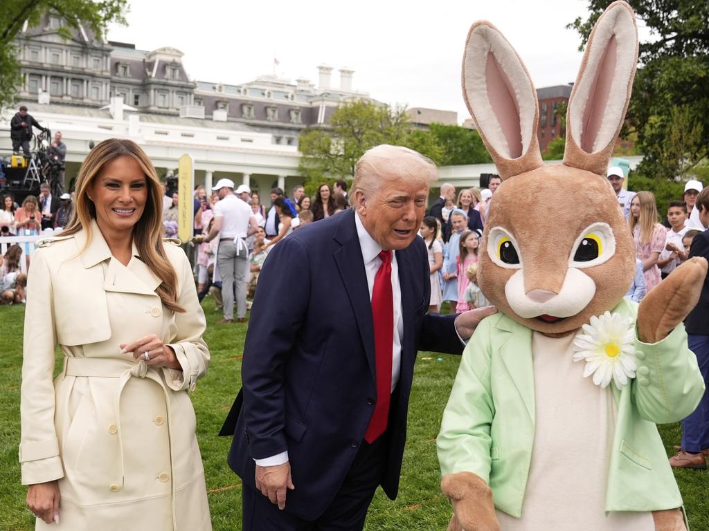 President Donald Trump and first lady Melania Trump, stand with the Easter bunny as they participate in the White House Easter Egg Roll. Picture: AP Photo/Mark Schiefelbein