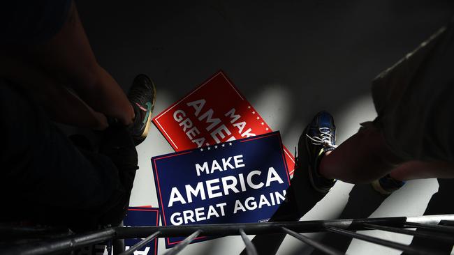 Campaign signs as US President Donald Trump delivers remarks on the economy at an airport hanger in Oshkosh, Wisconsin. Picture: AFP