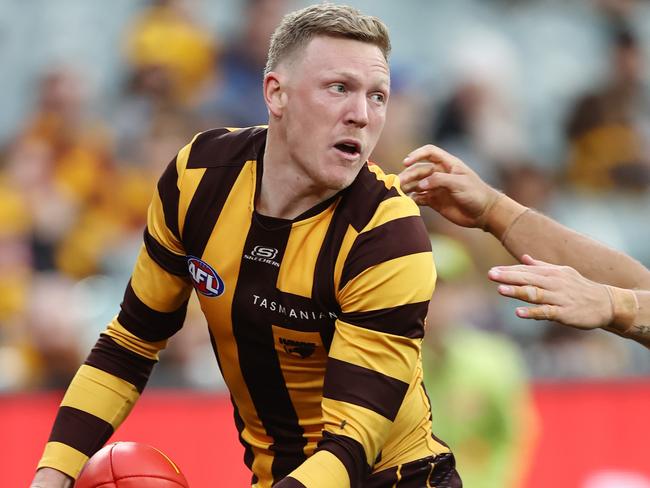 MELBOURNE - June 10  : AFL.   James Sicily of the Hawks  clears infront of Cam Rayner of the Lions during the round 13  AFL match between Hawthorn and the Brisbane Lions at the MCG on June 9, 2023, in Melbourne, Australia. Photo by Michael Klein.