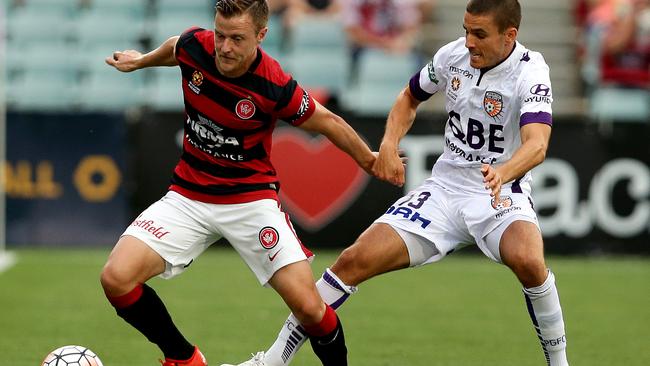 Wanderers Scott Jamieson and Perth's Diogo Ferreira compete for possession.