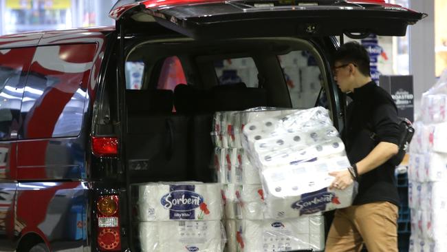 One Coles customer was seen loading multiple packets of toilet paper into the van of his car due to coronavirus panic. Picture: Bill Hearne