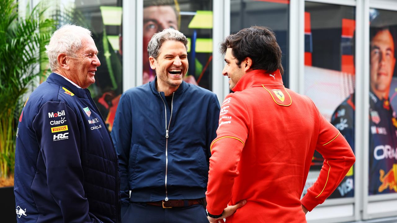 Oracle Red Bull Racing Team Consultant Dr Helmut Marko, Peter Hardenacke of Sky Germany and Carlos Sainz of Spain and Ferrari talk in the Paddock. (Photo by Mark Thompson/Getty Images)