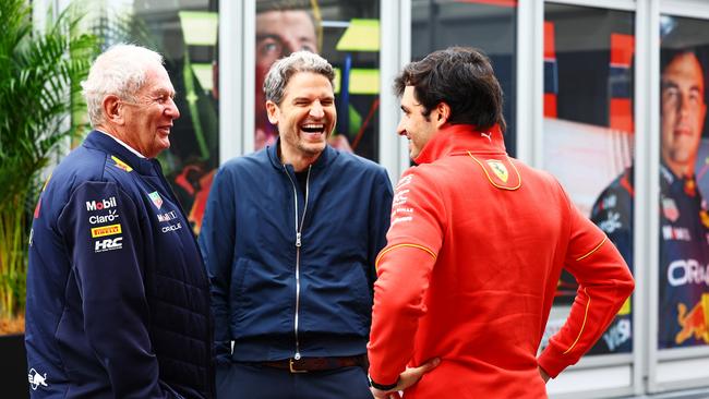 Oracle Red Bull Racing Team Consultant Dr Helmut Marko, Peter Hardenacke of Sky Germany and Carlos Sainz of Spain and Ferrari talk in the Paddock. (Photo by Mark Thompson/Getty Images)