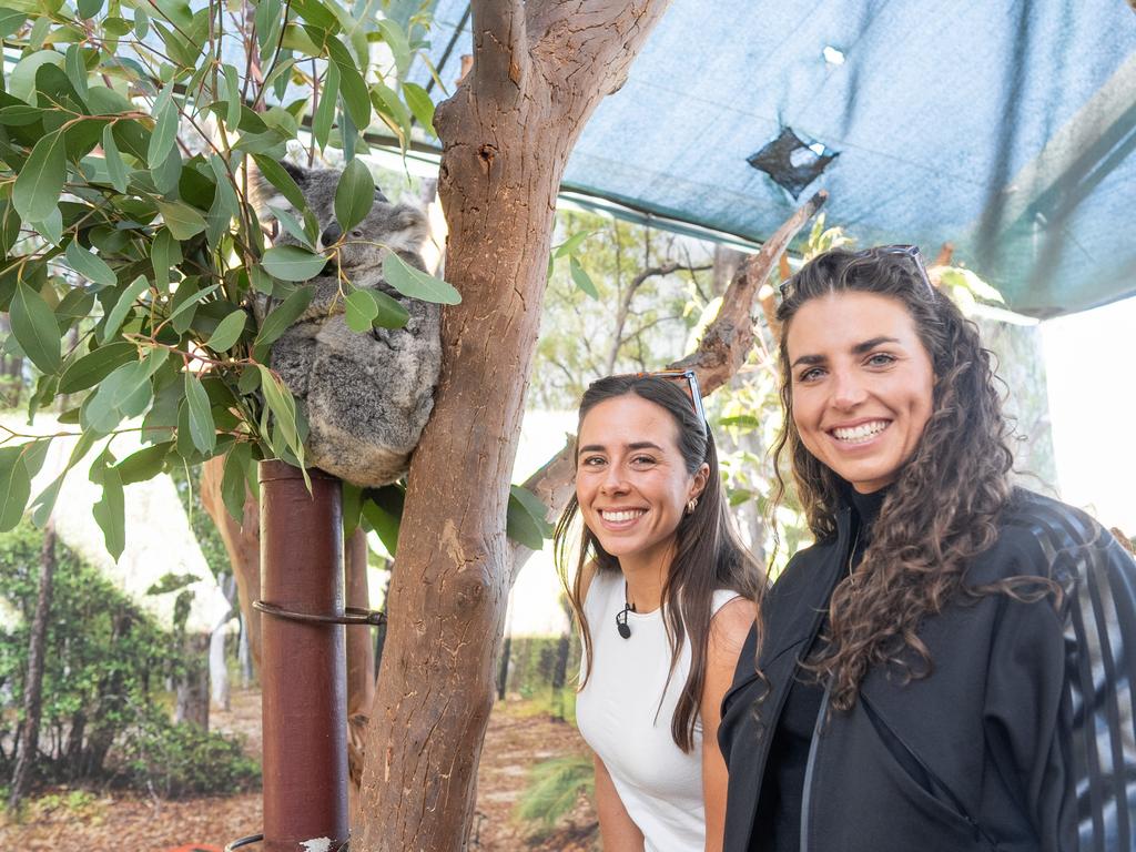 KIDS NEWS 2024: Superstar Olympic gold medallists sisters Noemie Fox, left, and sister Jessica Fox, meet their namesake joey koala, 10-month-old  Fox at Wild Life Sydney Zoo in a week the same week an island at Penrith Whitewater Stadium was named for their family. Picture: supplied