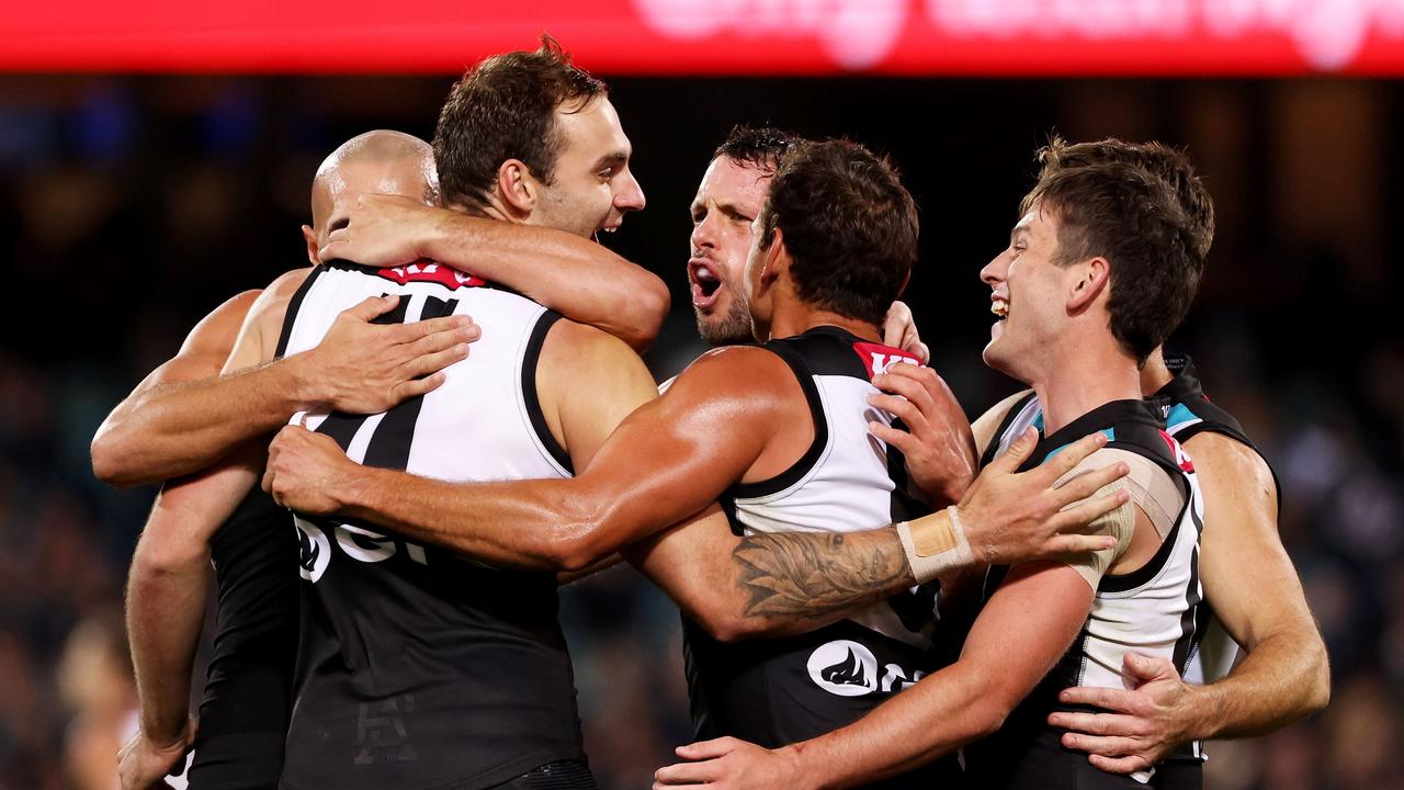 The Power boys get around Jeremy Finlayson after goal. Picture: AFL Photos/Getty Images