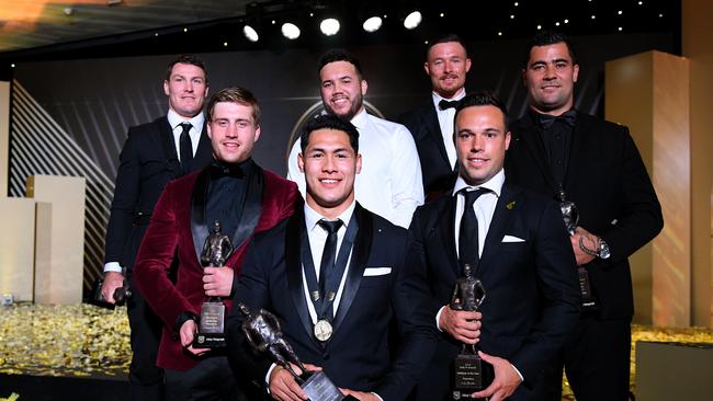 2018 Dally M Award winner, New Zealand Warriors' Roger Tuivasa-Sheck (centre) poses for a photograph with Dally M team of the Year members (L-R) Josh Jackson, Cameron munster, Jazz Tevaga, Damien Cook, Luke Brooks and Andrew Fifita, in Sydney, Wednesday, September 26, 2018. The awards are named in honour of former Australian Rugby League great Herbert Henry 'Dally' Messenger, and were introduced in 1980. (AAP Image/Dan Himbrechts) NO ARCHIVING