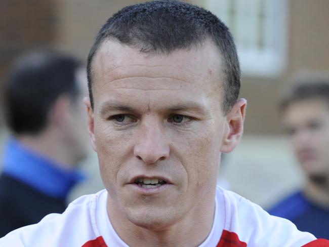 Former Sydney Swans player Jared Crouch coaches kids at Knox Grammar, both AFL and kicking techniques for rugby