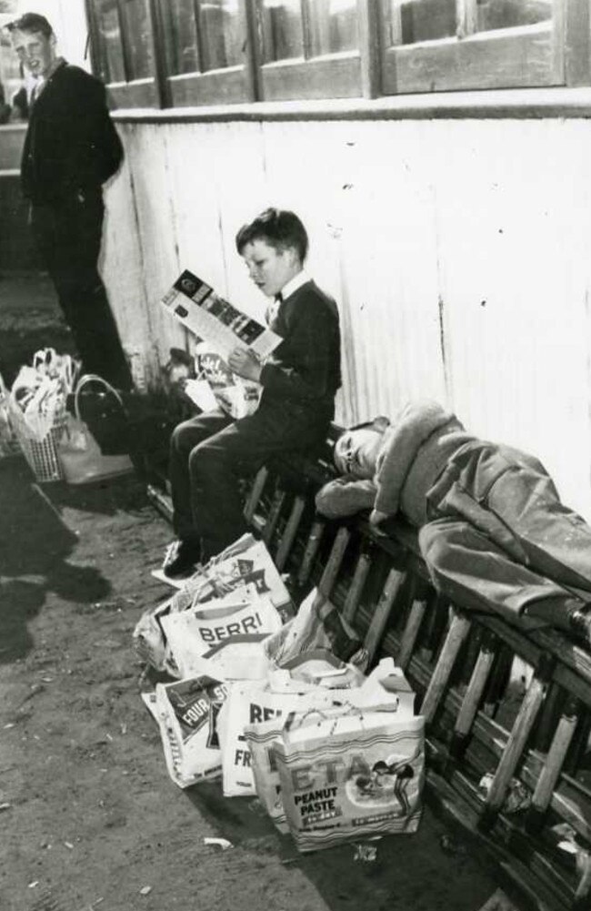 Date unknown — Tired children wait with their showbags.