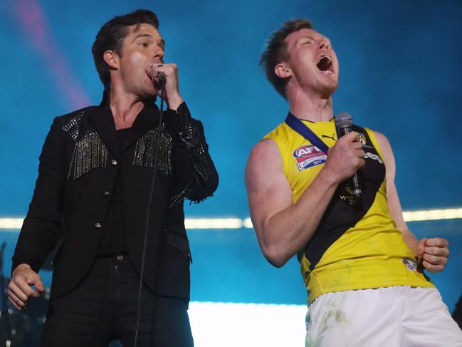 The 2017 AFL Grand Final between the Adelaide Crows and Richmond Tigers at the Melbourne Cricket Ground. The Killers lead singer Brandon Flowers with Jack Riewoldt.    Picture: Alex Coppel.