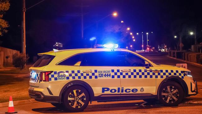 Police at the scene of the siege in Cranbourne. Picture: Ian Currie