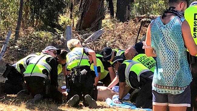 The consequences of taking drugs can be dire: Emergency services personnel help a man before he is taken to hospital at the Rainbow Serpent Festival