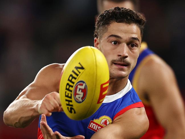 MELBOURNE . 30/03/2023.  AFL Round 3.   Western Bulldogs vs Brisbane Lions  at Marvel Stadium.   Bulldog Riley Garcia clears by hand . Pic: Michael Klein