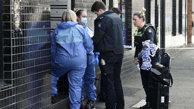 Police at the scene in Footscray where a woman was found dead. Picture: Andrew Henshaw