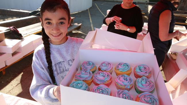 Zoe Gizariotis, 11, with these rocking cupcakes she made for her school’s cake stall at Willoughby Public School. Picture: AAP