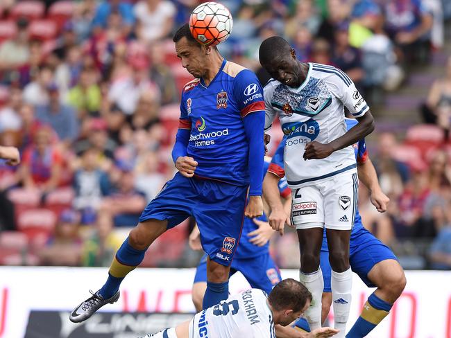 Victory defender Jason Geria challenges Milos Trifunovic of the Jets. Picture: AAP