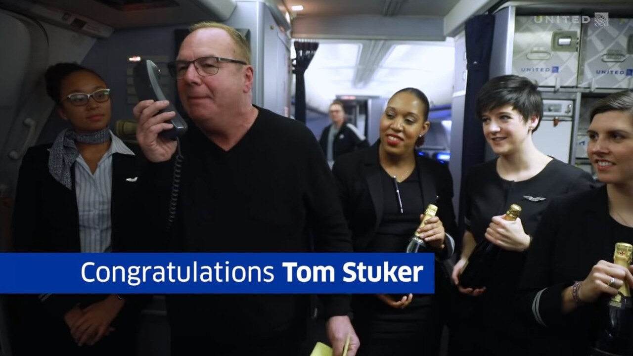 Everyone on board that flight got free champagne and Tom thanked them all for being part of his history-making moment. Picture: YouTube/United