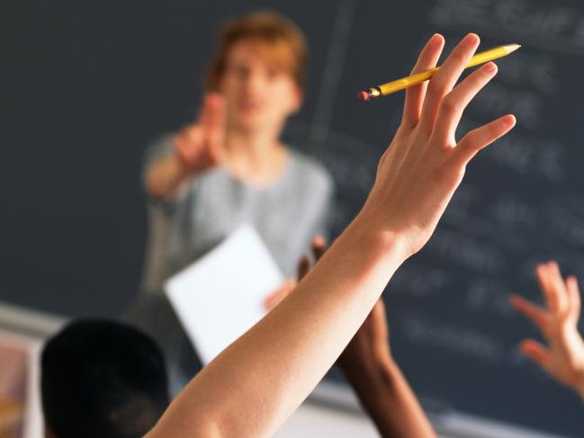 Teacher pointing to raised hands in classroom, Classroom, teaching generic, education generic, Teacher, Learning, Hand Raised, Education, Adult, School Building, Pointing, Standing, Image, Women, Adults Only, Colour Image, Horizontal, Human Arm, Human Body Part, Human Limb, Incidental People, Indoors, Limb, One Person, Only Women, People, Photography, thinkstock, generic, istock