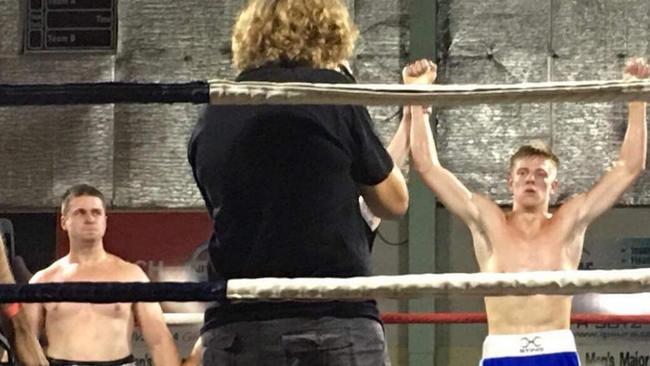 A victorious Kieran Rocke at a boxing match.