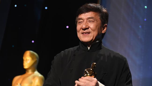 Honoree Jackie Chan poses with his Honorary Oscar Award