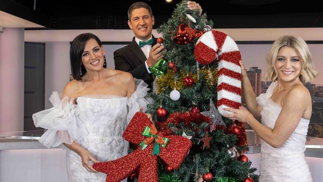 7 New Adelaide’s Rosanna Mangiarelli, Will Goodings and Amelia Mulcahy preparing to host Adelaide’s 80th Carols by Candlelight on December 14. Picture: Kelly Barnes