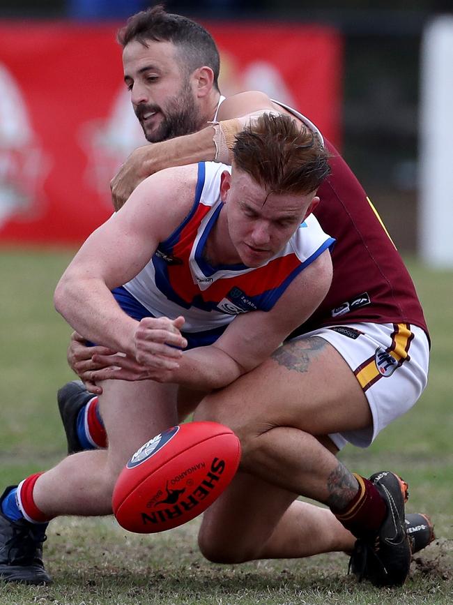 Corey Ray is tackled by Matt Duckworth.