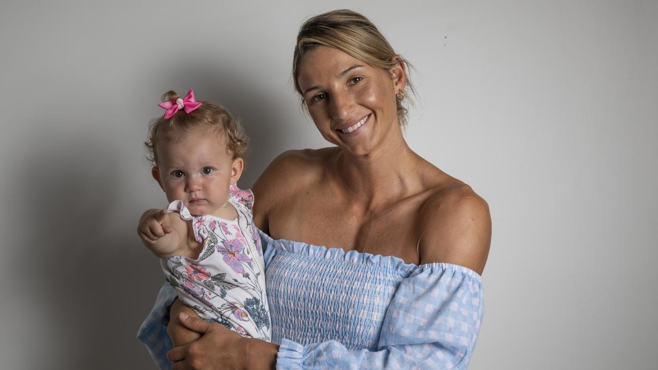 Kim Ravaillion, with Georgie, then 10 months old, after announcing her return to the Firebirds. Pic: Mark Cranitch.