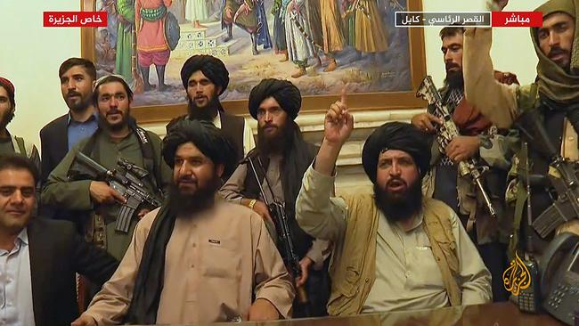 Members of Taliban in the presidential palace in Kabul after Afghanistan's president fled the country. Picture: AFP