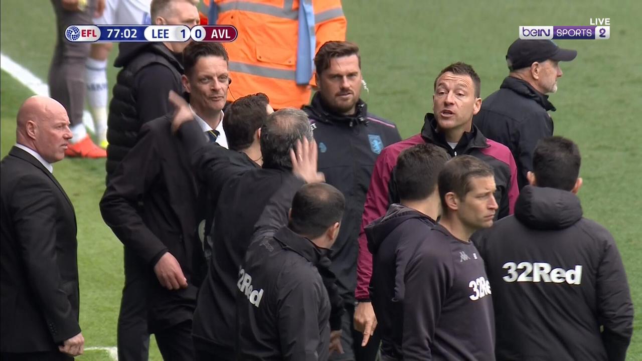 Leeds manager Marcelo Bielsa and Villa assistant manager John Terry clash on the touchline.