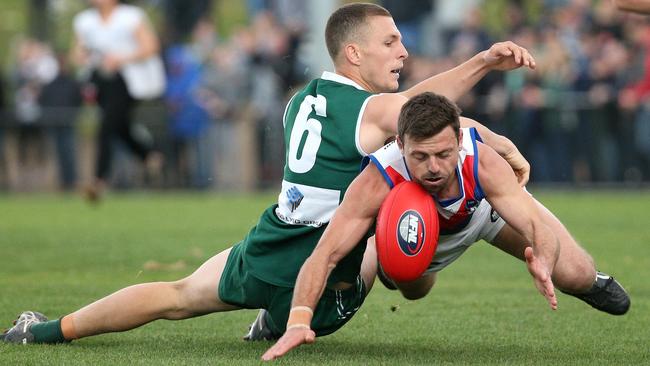 Luke Lirosi and Michael Croxford battle for the ball. Picture: Hamish Blair