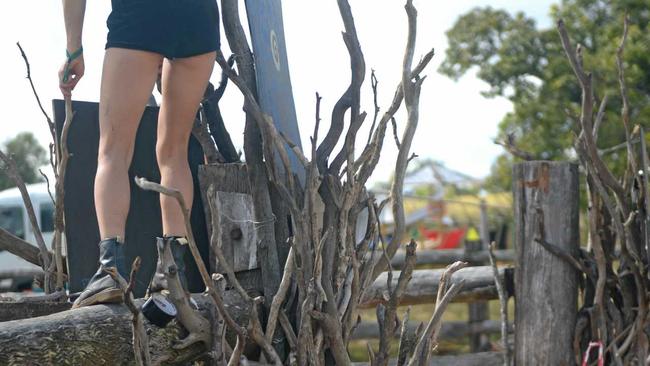 Melbourne gymnasts May Krason-Plarre and Claire Tobin construct the entrance to Tropical Bloom festival. Picture: Jann Houley