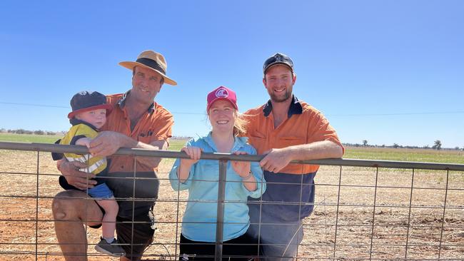 David Fox holding grandson Hugo Fox, 18 months, with son Dan (right) and daughter-in-law Rachel. They are pictured at Marrar in Southern NSW. Picture: Nikki Reynolds