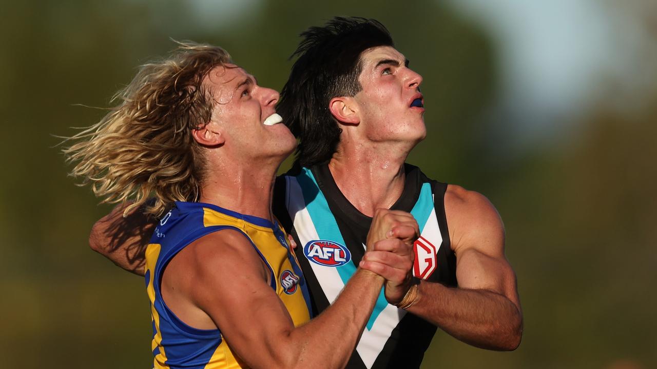 Callum Jamieson competes against Port’s Dante Visentini. Picture: Will Russell/AFL Photos via Getty Images