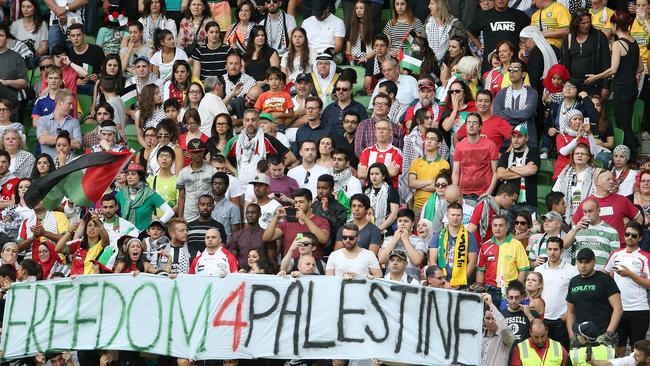 Security pull down a free Palestine banner during the game.