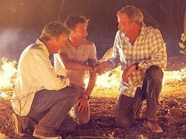 Top Gear's hosts Richard Hammond, James May, and Jeremy Clarkson in a ring of fire during the filming of an episode in the Northern Territory. Picture: Top Gear