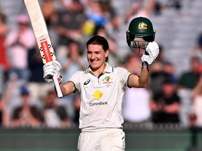 A beaming Annabel Sutherland salutes the MCG crowd after reaching her third Test century.