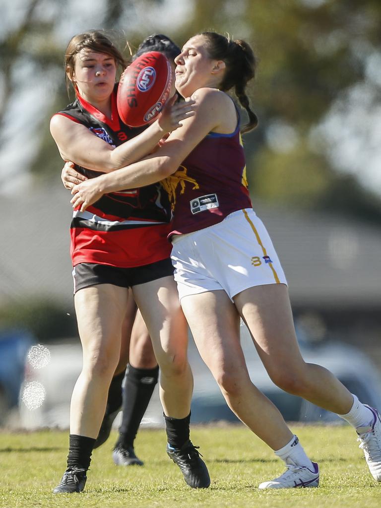 South East Women’s: Skye’s Lara Holden Russell gets tackles by Ally Williams of Murrumbeena. Picture: Valeriu Campan