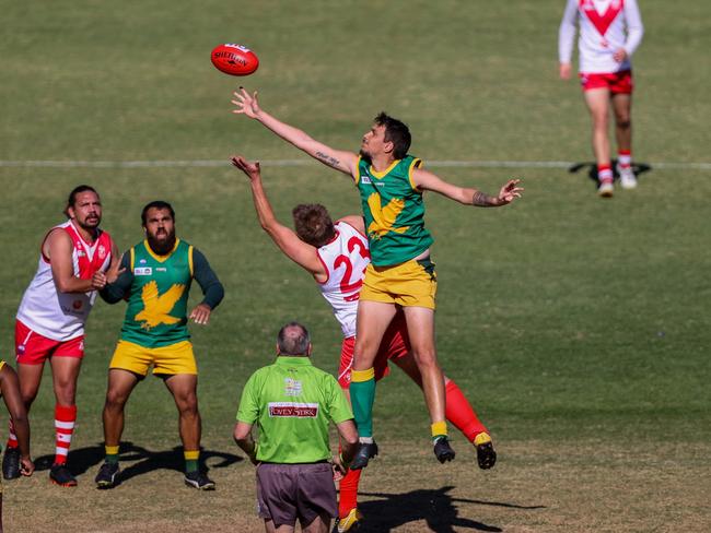 Pioneer ruckman Cheyne Miles flies in the 2022 grand final. Picture: AFLNT.