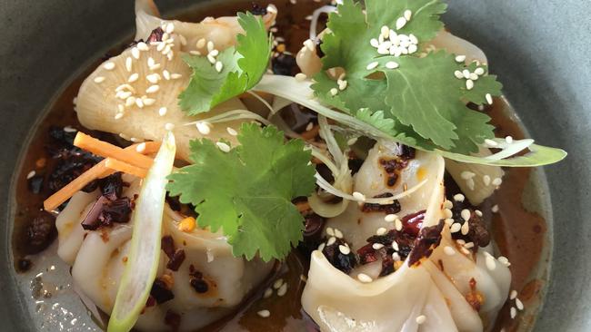 Shanghai pork soup dumplings with chilli dressing.