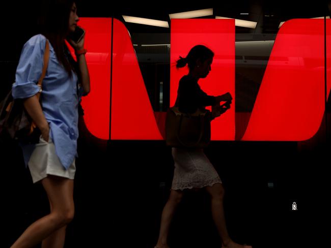 SYDNEY, AUSTRALIA - MARCH 27: Pedestrians walk past Westpac Banking Corp. logo at Westpac Place building on March 27, 2024 in Sydney, Australia. In the last quarter, Westpac Bank reported a quarterly cash profit of A$1.8 billion, meeting consensus expectations, while NAB experienced a 17% decline in first-quarter cash profit compared to the previous corresponding period, reflecting varying performances among the major Australian banks. (Photo by Brendon Thorne/Getty Images) (Photo by Brendon Thorne/Getty Images)