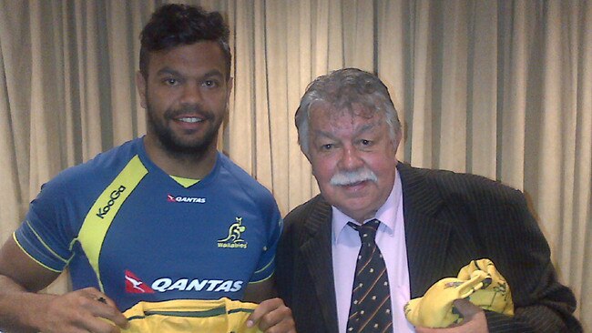 Beale is presented a jersey by Lloyd McDermott, the first Aboriginal Wallaby. Photo: Matt McIlraith