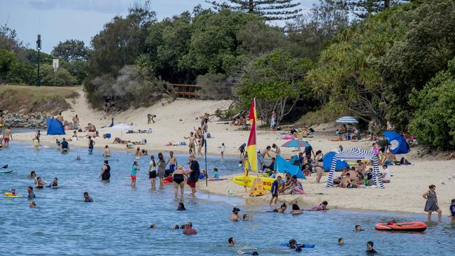 Locals and holiday-makers are warned to swim between the flags after three young girls were rescued from Tallebudgera Creek today. Picture: Jerad Williams