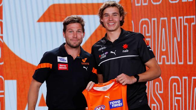 Toby Greene presents Cadman with his GWS jumper. Picture: Dylan Burns/AFL Photos