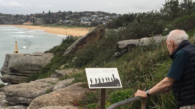 Monument designer and creator Kevin Douglas Martin looks out at damaged memorial on the North Curl Curl cliffs Picture: Jason Martin